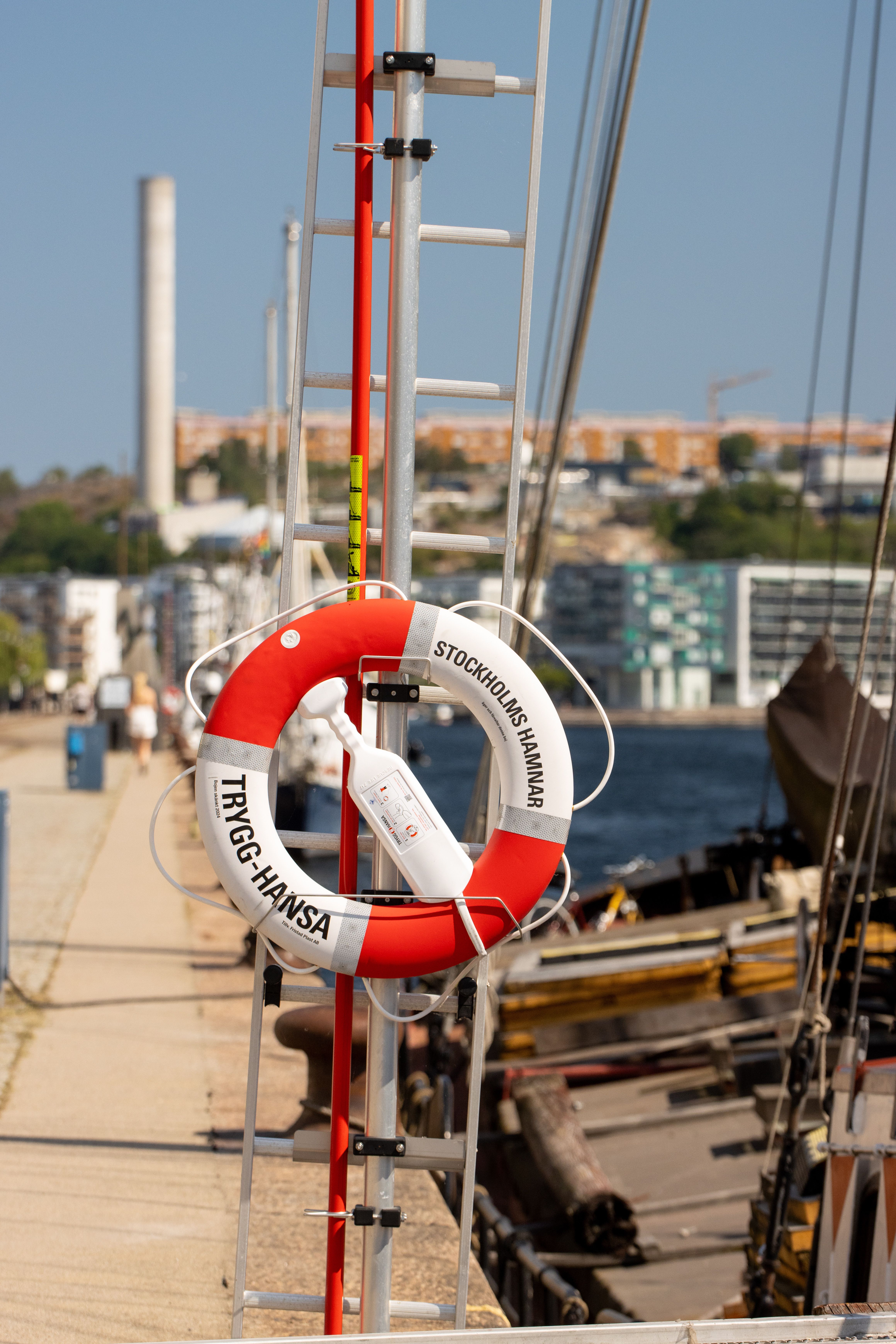 A red and white lifesaver ring on a pier in Stockholm, Sweden.