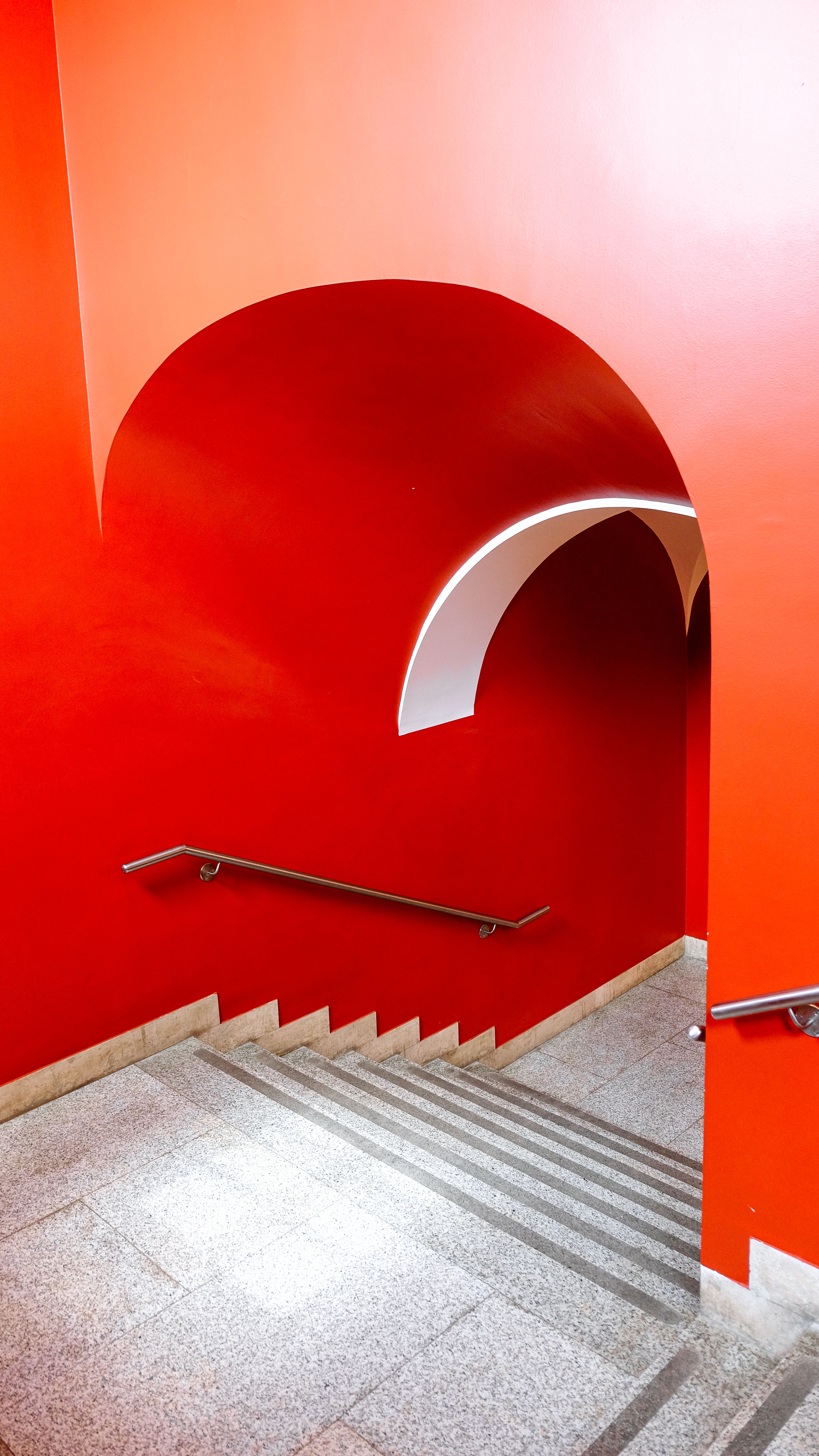 Vivid Red Staircase with Arched Design · Free Stock Photo