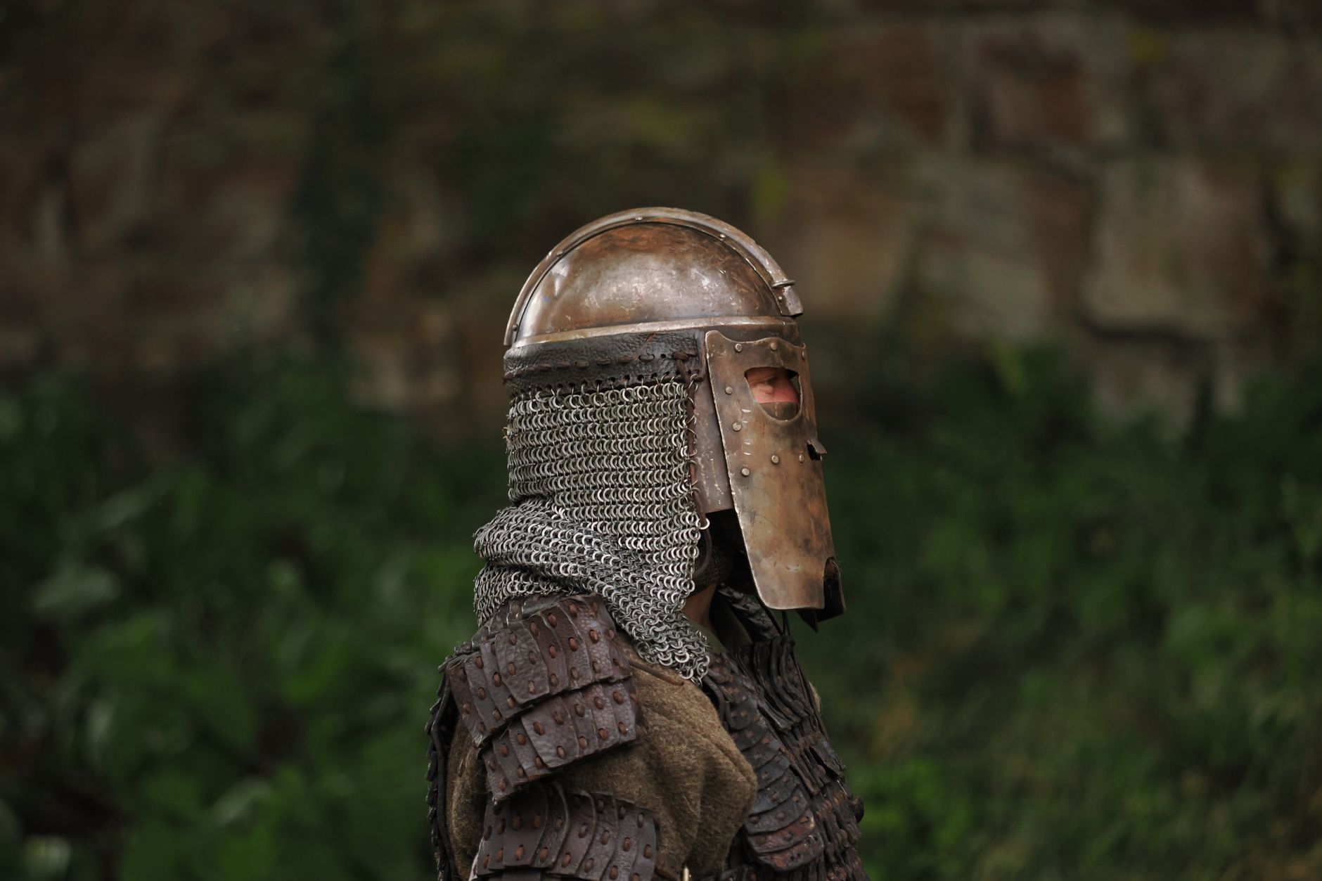 A knight in full medieval armor standing outdoors in Höxter, Germany.