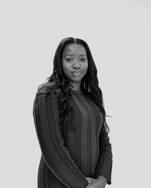 Free A poised woman in a black and white portrait, exuding elegance and confidence. Stock Photo