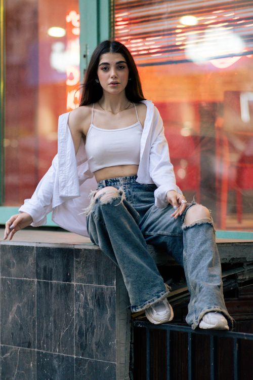 Free Chic portrait of a young woman in trendy fashion, Tehran cityscape. Stock Photo