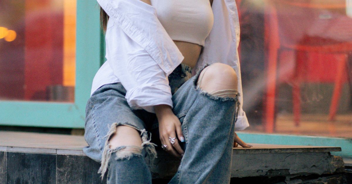 Woman in frayed-hem jeans and simple tee
