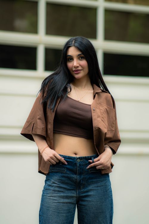 Stylish Woman Posing Outdoors in Tehran's Urban Setting · Free Stock Photo