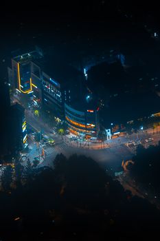 A vibrant aerial night view capturing bustling streets in Seoul, South Korea.
