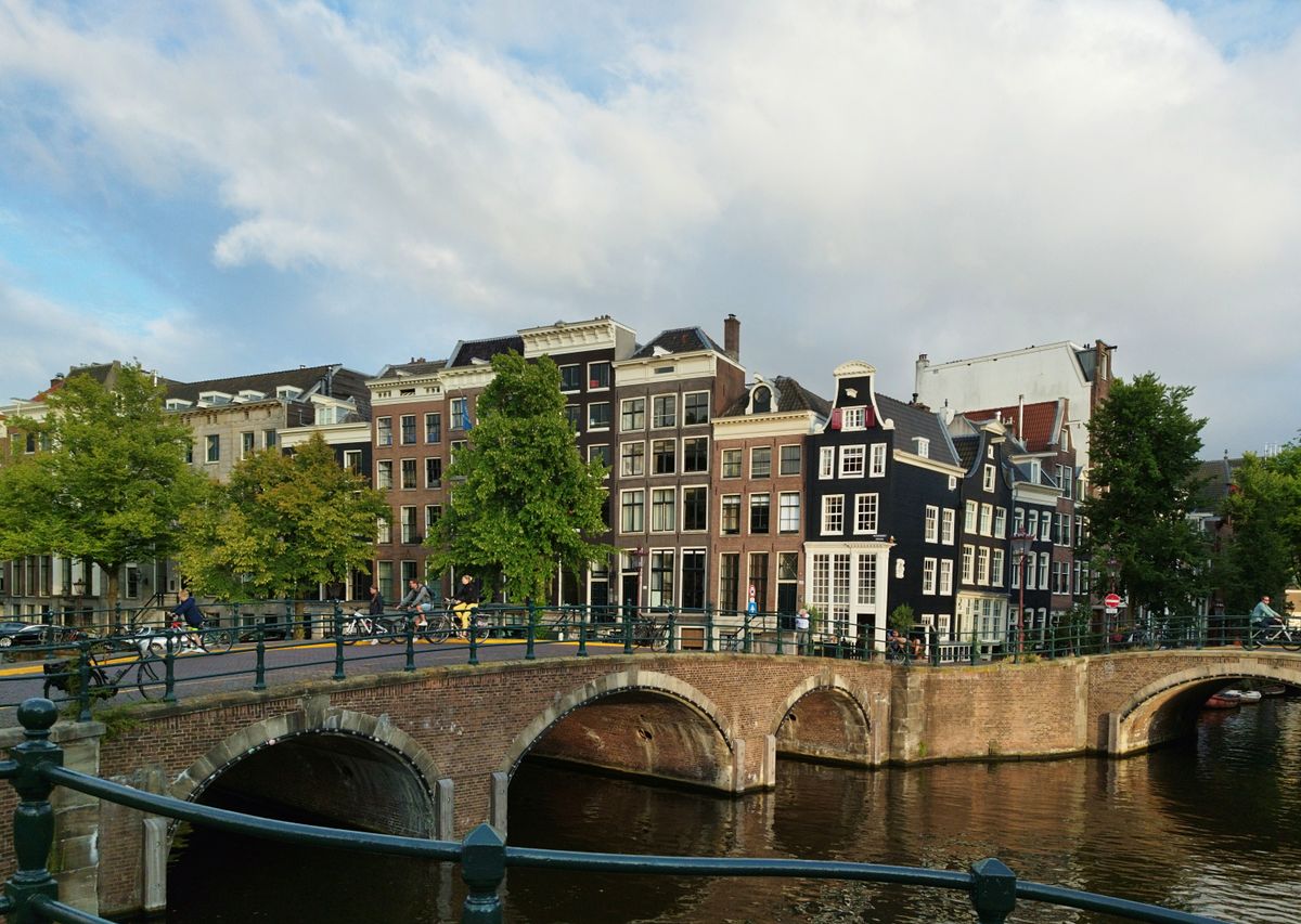 Traditional canal houses and a bridge in central Amsterdam