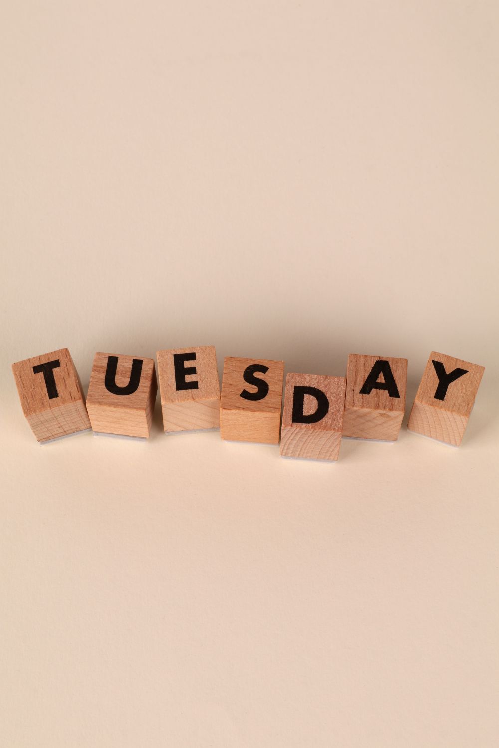 Tuesday Building Blocks Tuesday Wooden Blocks Display on Plain Background · Free Stock Photo