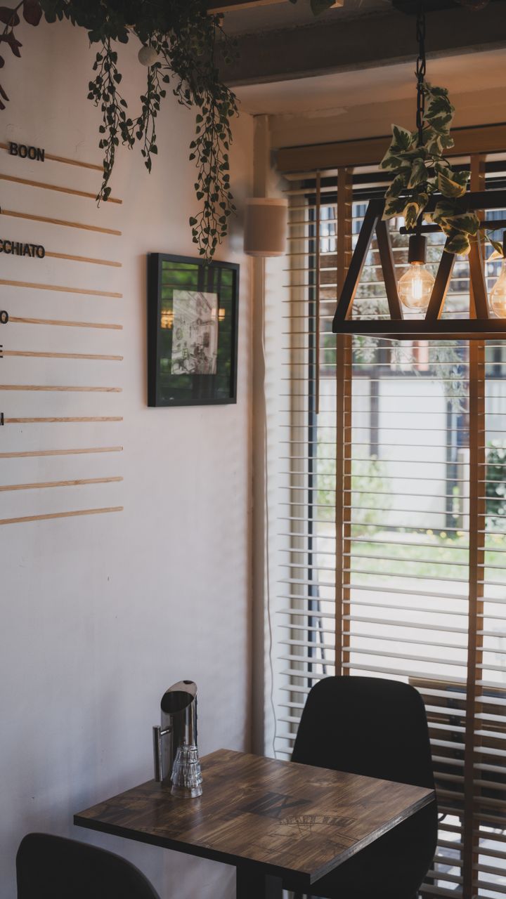 small corner coffee bar with LED strip lights under the shelf for soft illumination