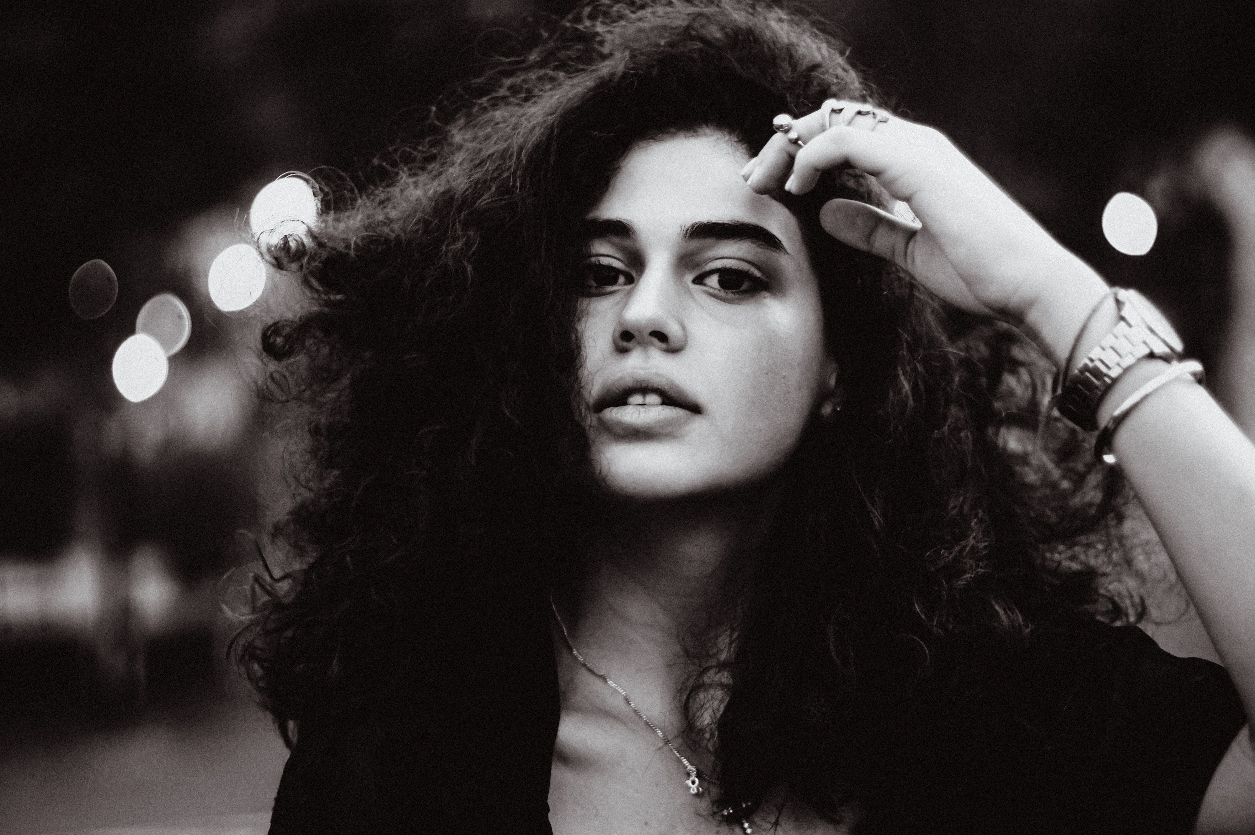 Moody Black and White Portrait of a Woman Outdoors · Free Stock Photo