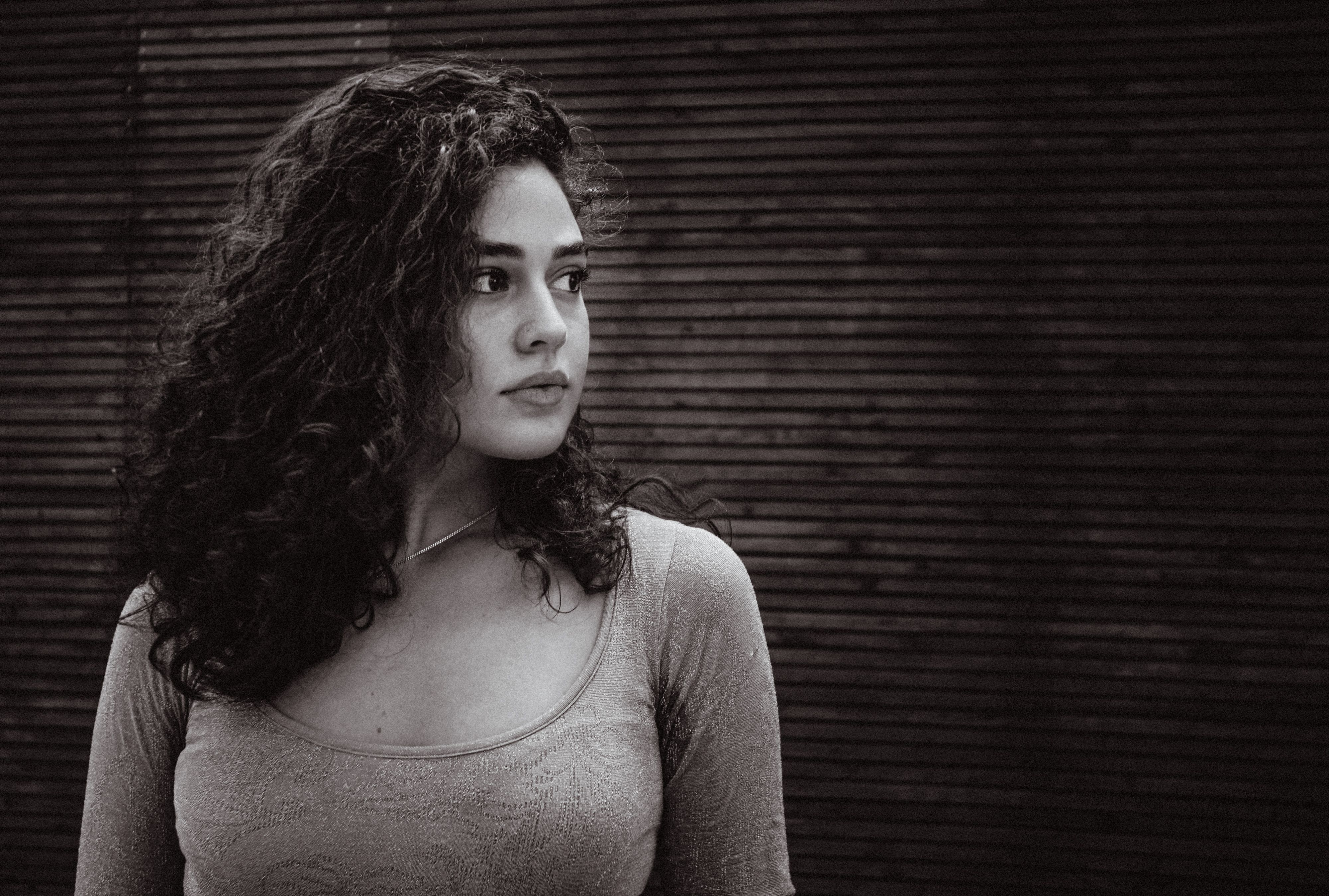 Moody Black and White Portrait of a Woman at Twilight · Free Stock Photo