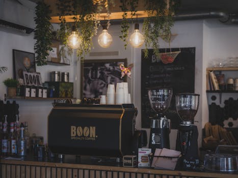 Cozy cafe with modern barista setup and lush decor in Almere, Netherlands.