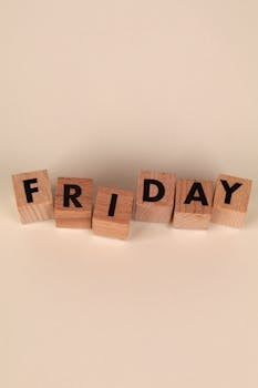 Photo by Ann H Wooden blocks arranged to spell 'Friday', perfect for weekend and planning themes.