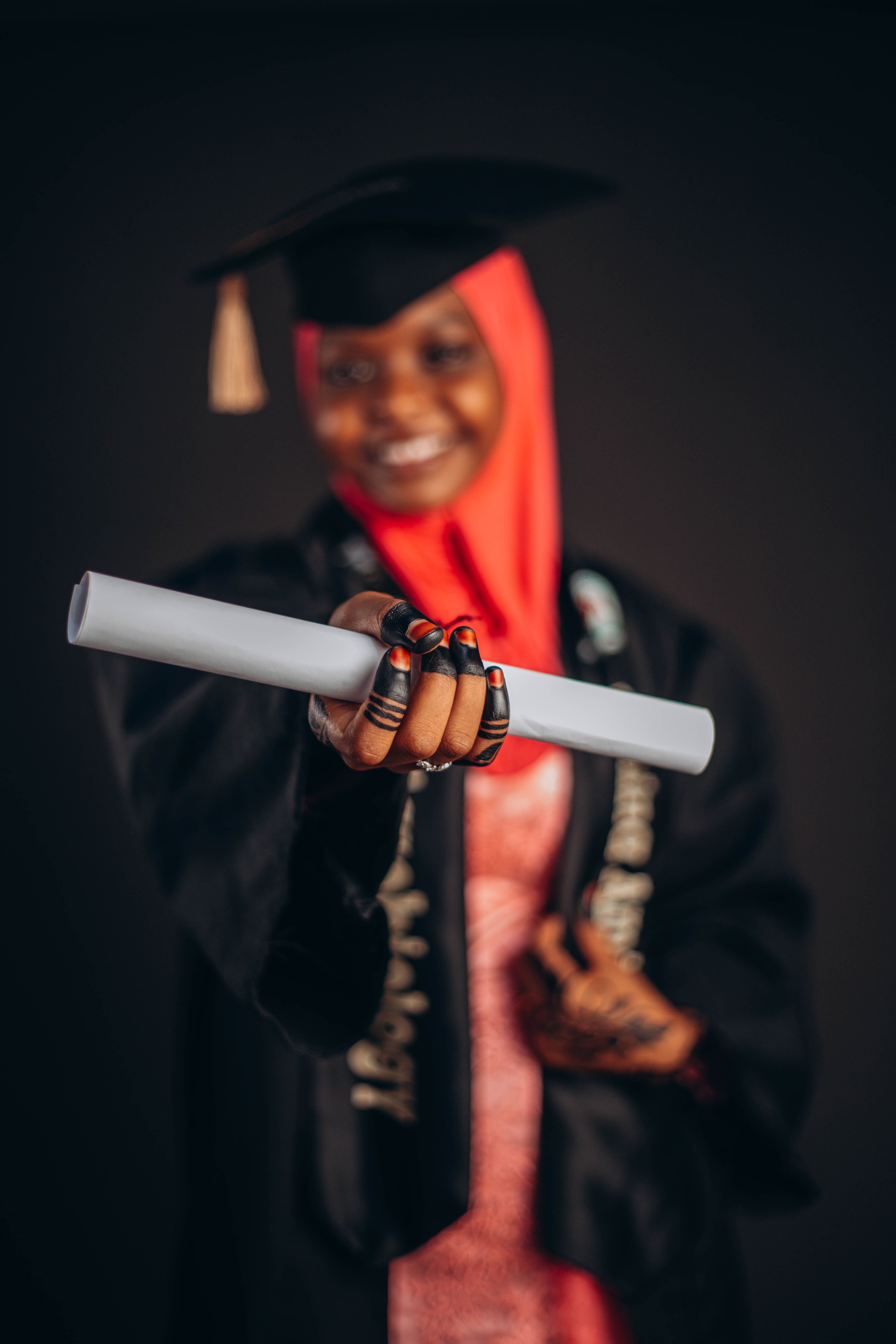 Graduation Celebration with Diploma in Focus · Free Stock Photo