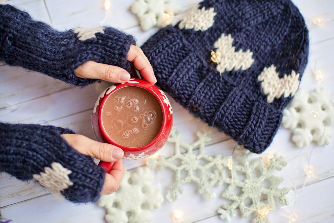 Person Holding Red Ceramic Mug