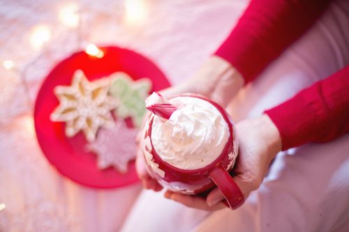 Free Warm up with hot cocoa and festive cookies in a cozy winter setting. Perfect for holiday indulgence. Stock Photo