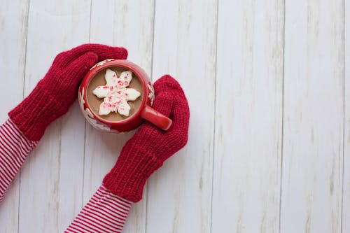 Free Person Wearing Red Gloves Holding Red and White Ceramic Mug Stock Photo