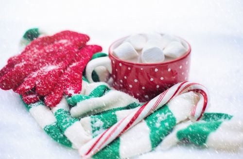 Free Warm up with hot cocoa in a festive setting, perfect for winter celebrations. Stock Photo