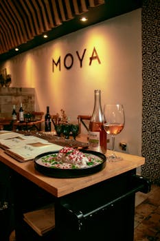 Elegant restaurant setting showcasing gourmet dish and wine pairing with warm ambiance.