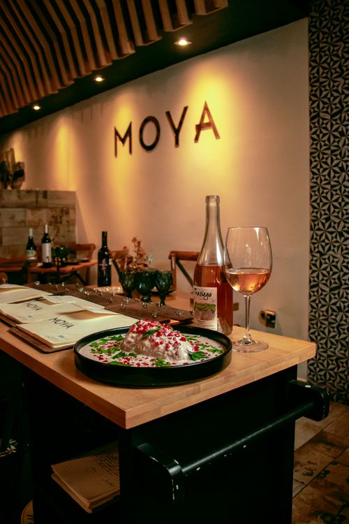 Free Elegant restaurant setting showcasing gourmet dish and wine pairing with warm ambiance. Stock Photo