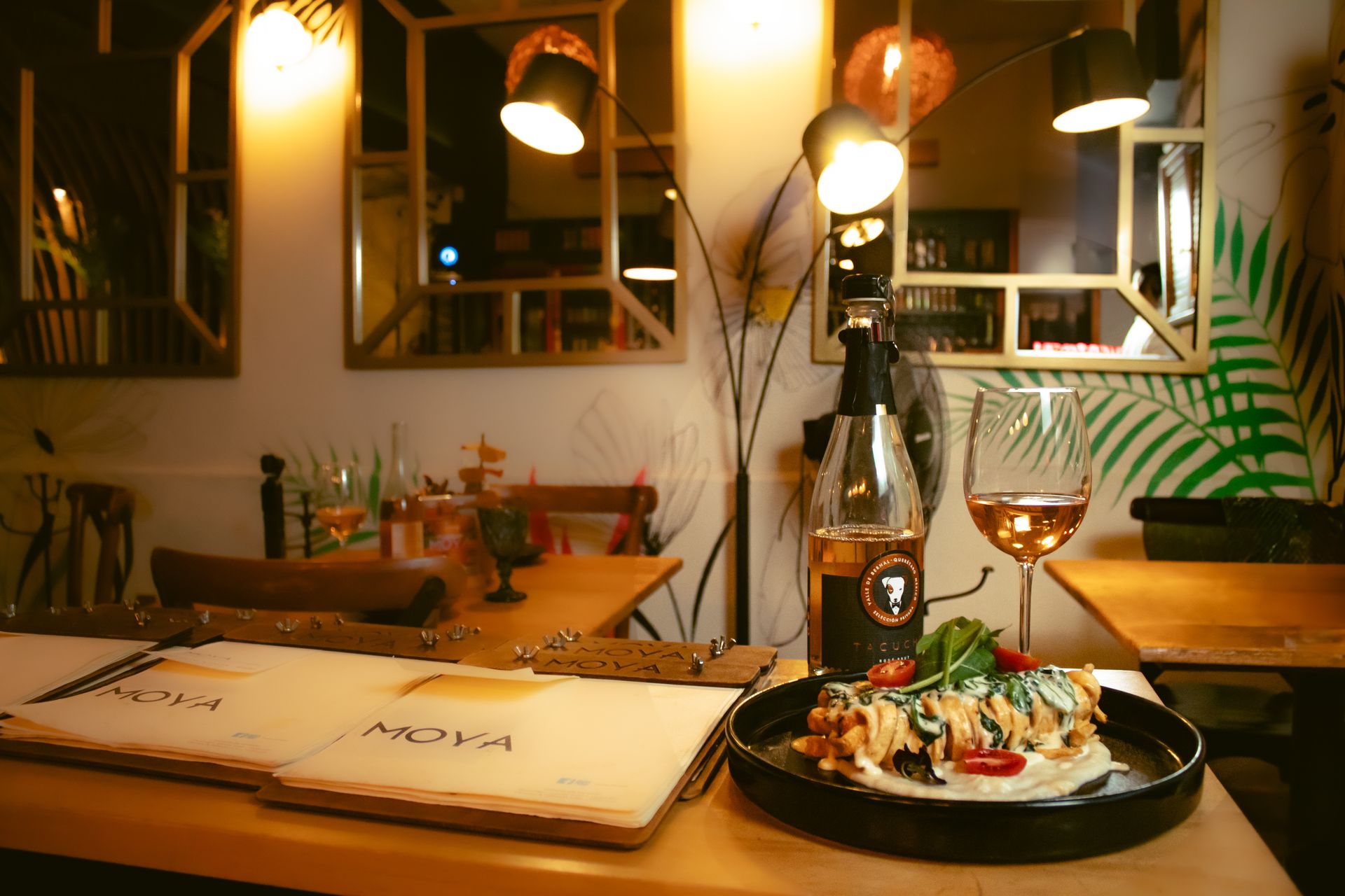 Elegant Miami restaurant dinner with wine and candlelight