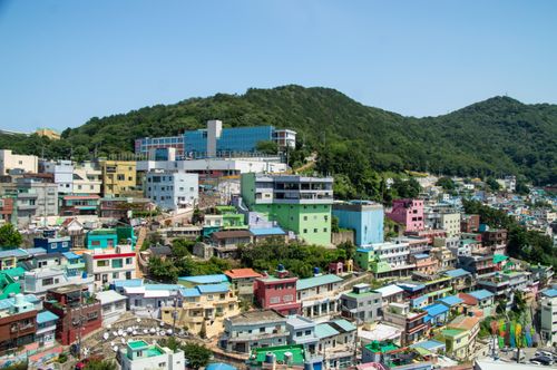 Free A vibrant aerial view of Busan's Gamcheon Culture Village with colorful houses and lush hills. Stock Photo