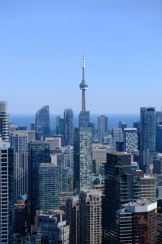 A breathtaking daytime view of Toronto's skyline featuring the iconic CN Tower amid skyscrapers.