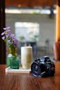 Vintage Camera with Coffee and Flowers on Table