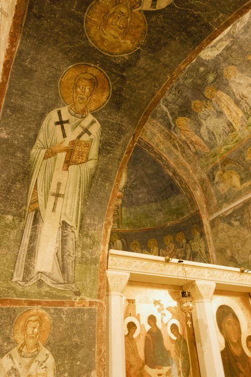 Free A detailed view of medieval frescoes and religious icons on a church ceiling, showcasing historical art. Stock Photo