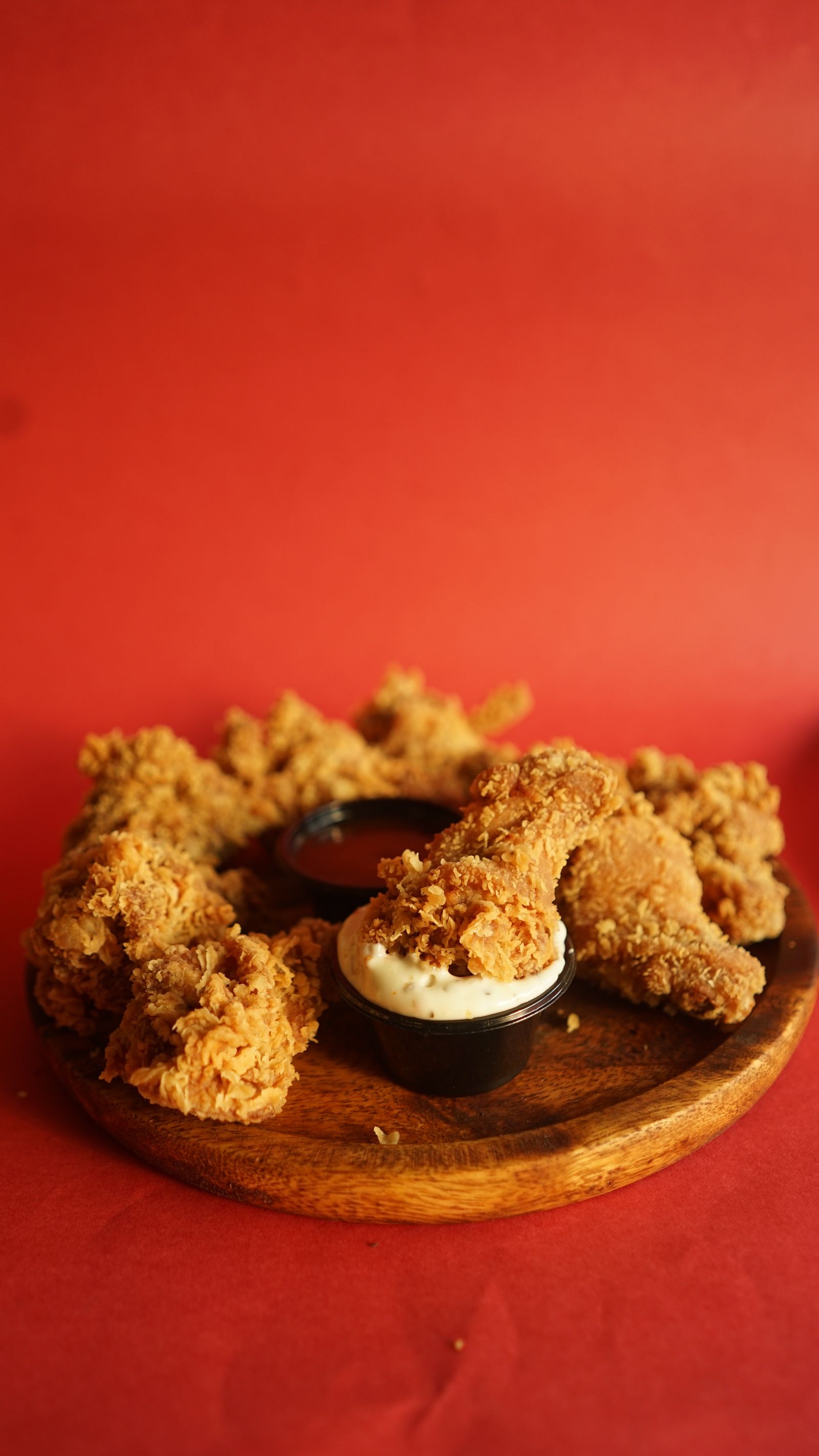 Crispy fried chicken platter with dipping sauce