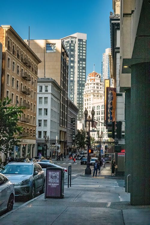 Free Vibrant street view in San Francisco with iconic skyscrapers and bustling city life. Stock Photo