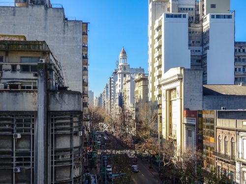 Free A vibrant street view of downtown Montevideo's architecture under a clear blue sky. Stock Photo
