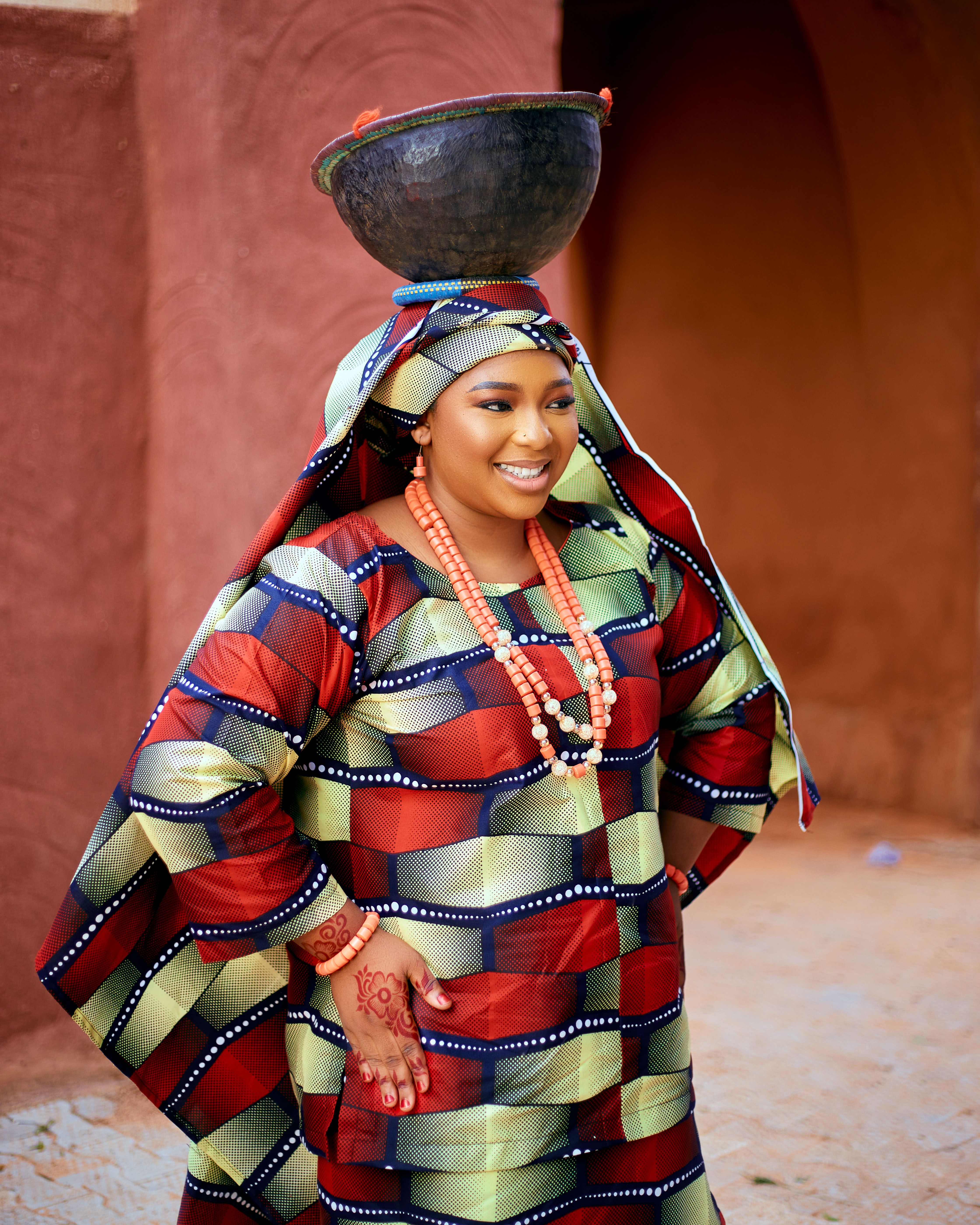 Colorful African Attire with Traditional Pot · Free Stock Photo