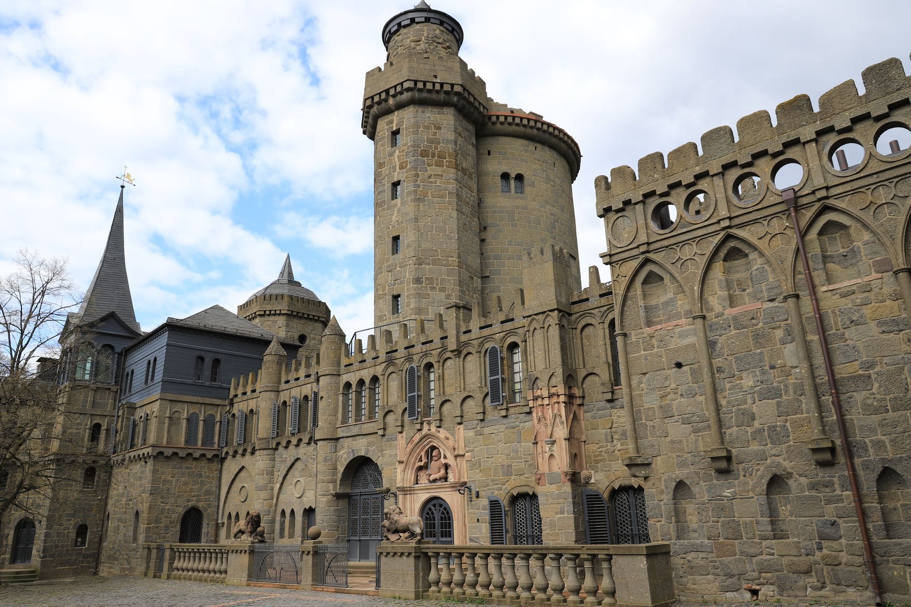 Majestic historical castle facade in Kassel, Germany, showcasing Gothic architecture.