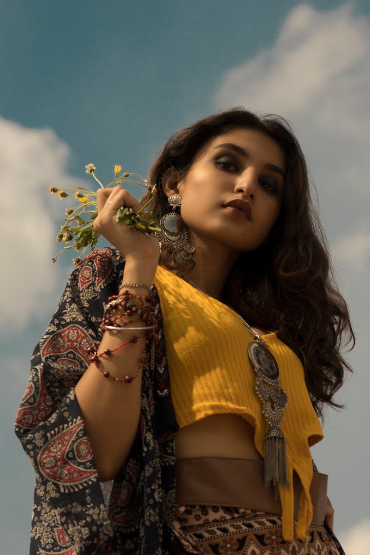 Photo Of Woman Holding Flowers