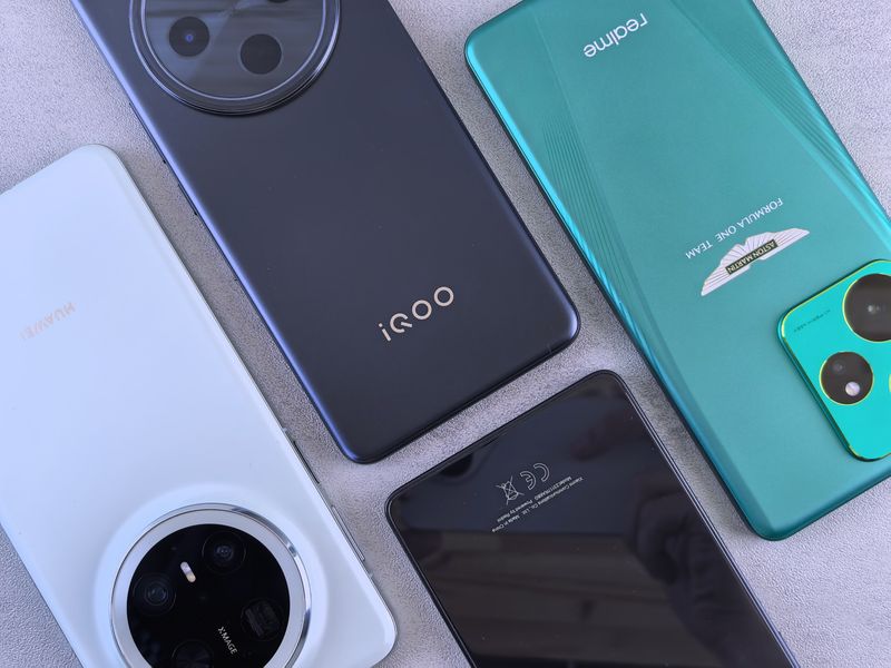 Smartphones flat lay showing multiple phone models