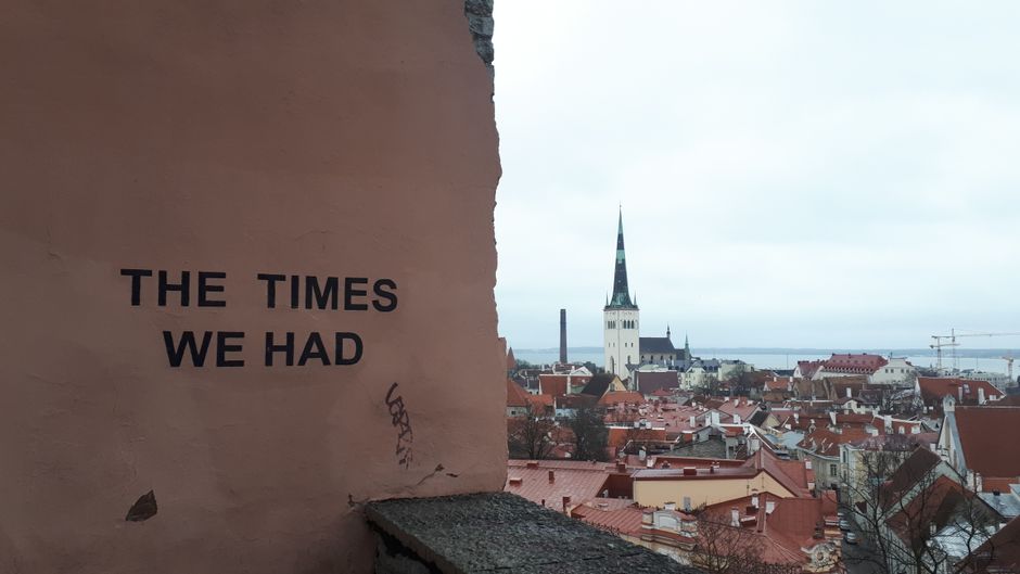 Scenic view of Tallinn's skyline with St. Olaf's Church, featuring the text 'THE TIMES WE HAD' on a wall.
