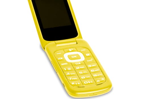 A vibrant yellow flip phone evokes nostalgia and retro communication technology.