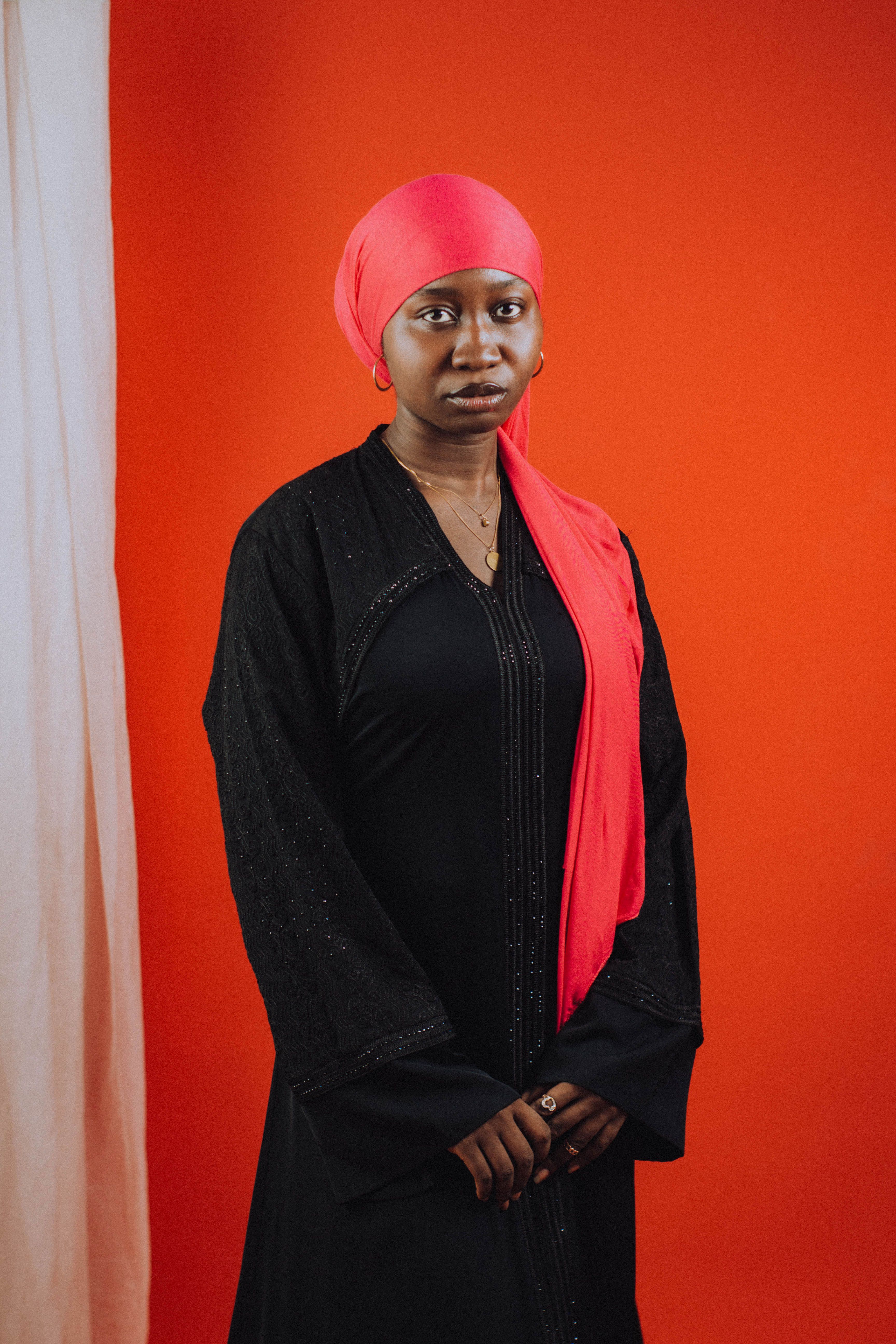 Elegant Portrait of Woman in Black Abaya and Red Hijab · Free Stock Photo