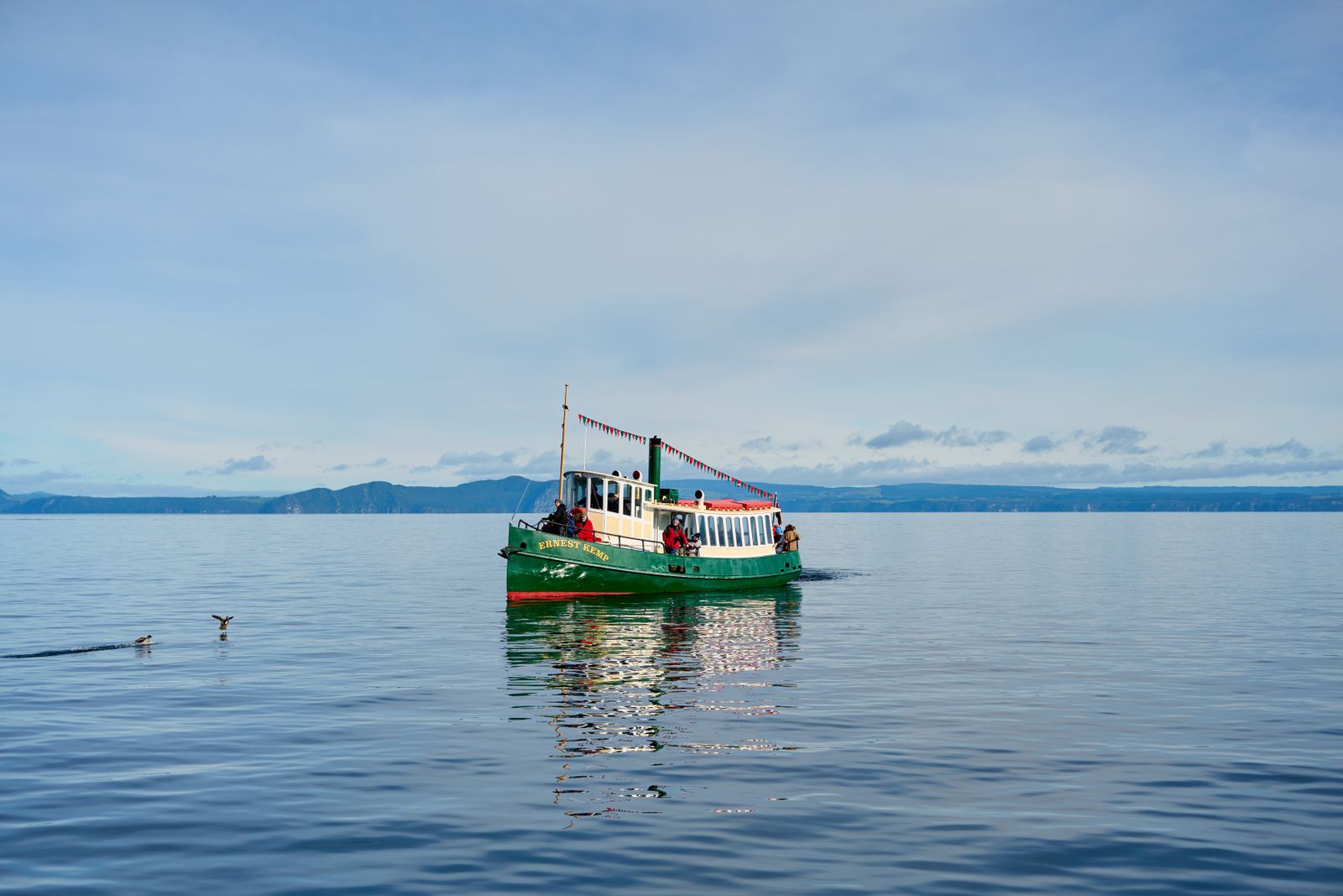 Lake Taupo boat New Zealand volcanic lake mountains