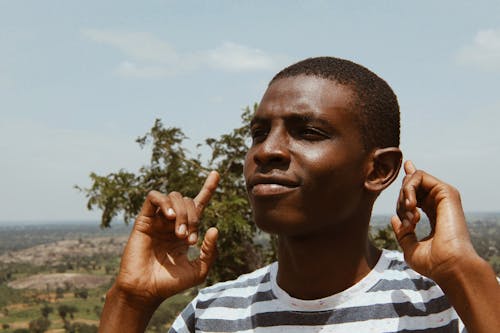 Photo Of Man Wearing Striped Shirt 