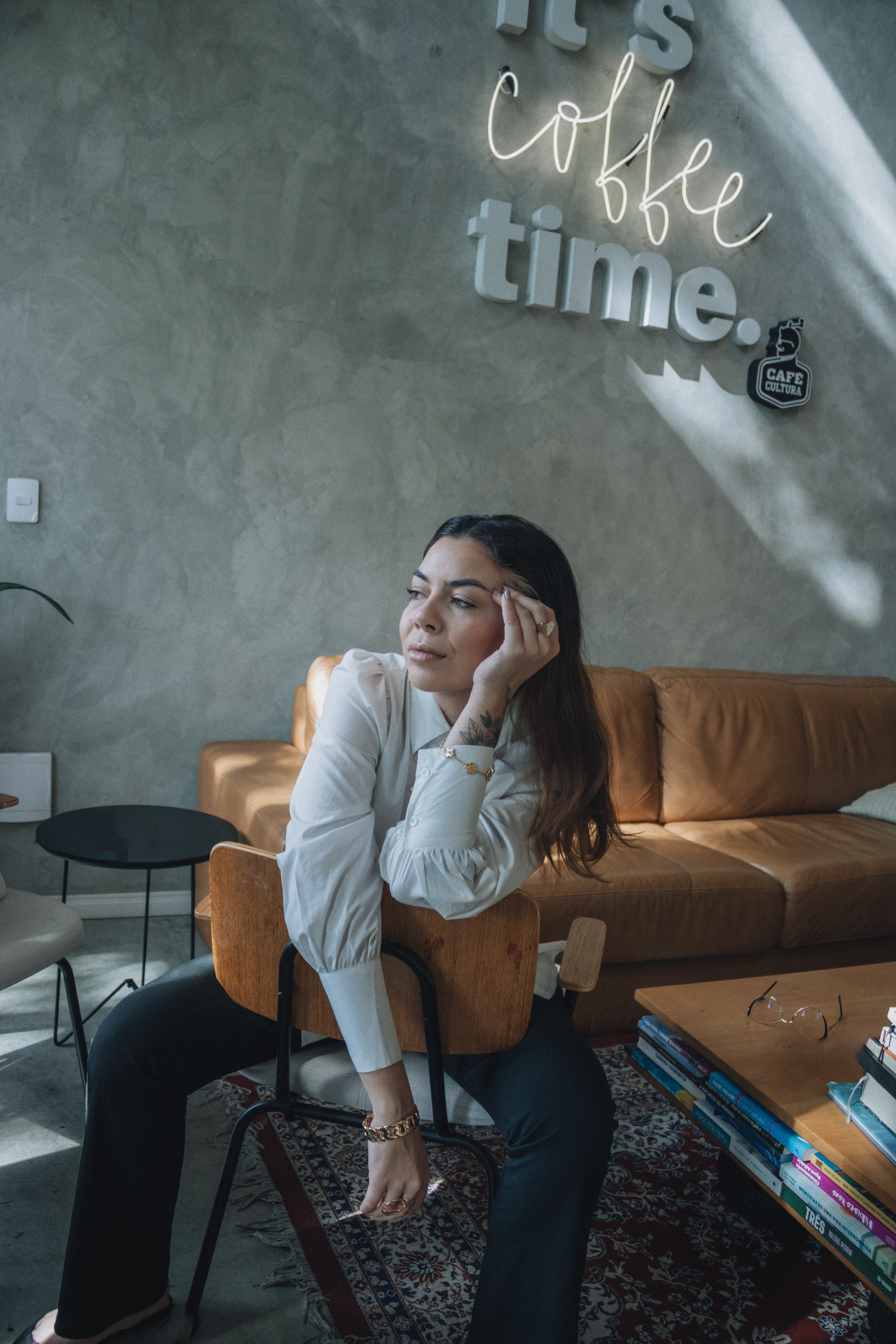 Elegant Woman Relaxing in Cozy Coffee Shop Interior · Free Stock Photo