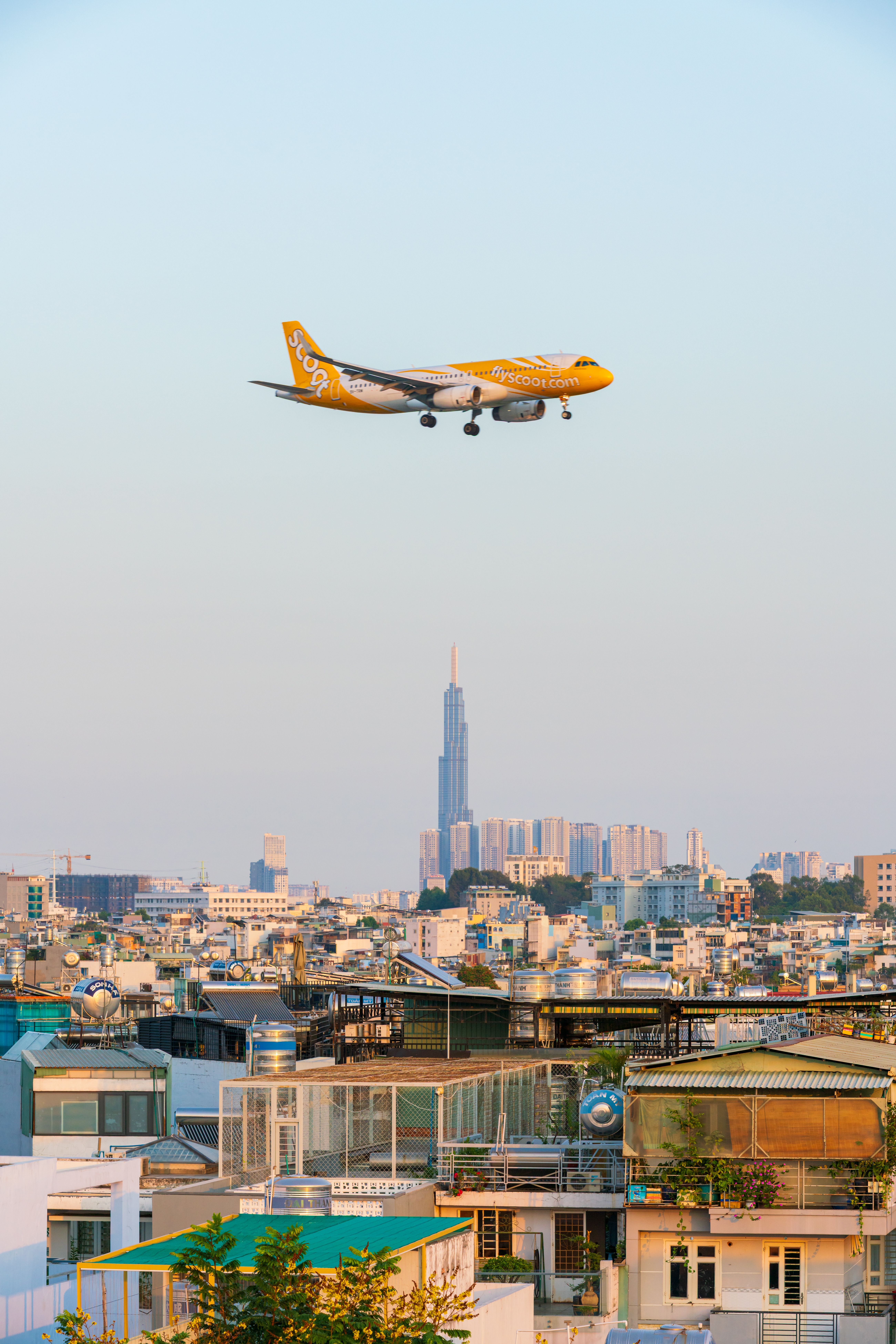 Airplane Flying Over Ho Chi Minh City Skyline · Free Stock Photo