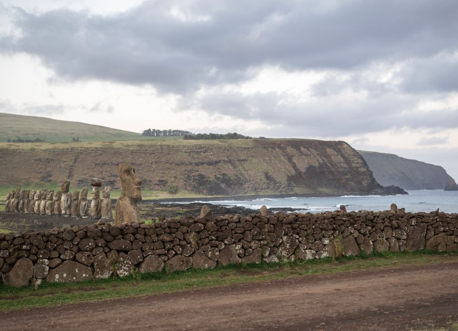 Explore the iconic stone Moai statues on the dramatic coastline of Easter Island, Chile.