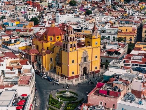 Free A colorful aerial view of the historic cityscape of Guanajuato featuring notable architecture. Stock Photo