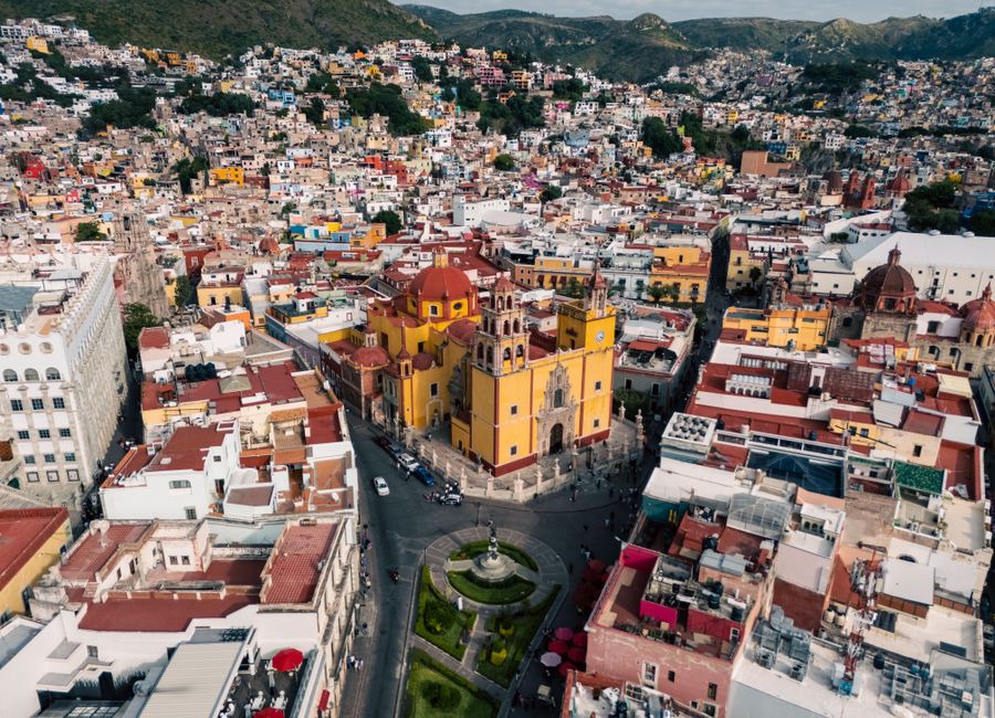 Aerial view of Guanajuato, Mexico, showcasing vibrant historic architecture and cityscape.