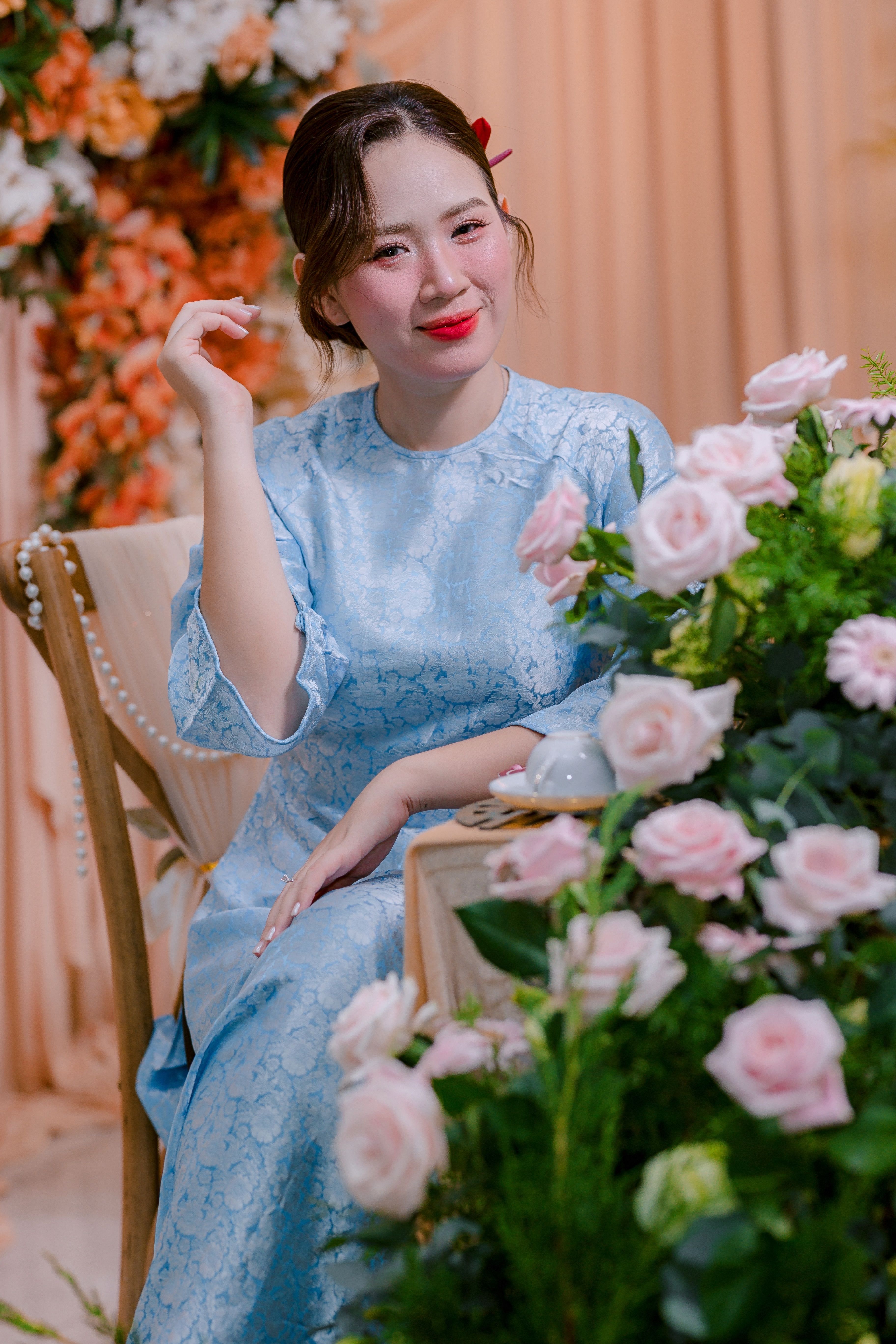 Elegant Woman in Blue Dress with Floral Decor · Free Stock Photo