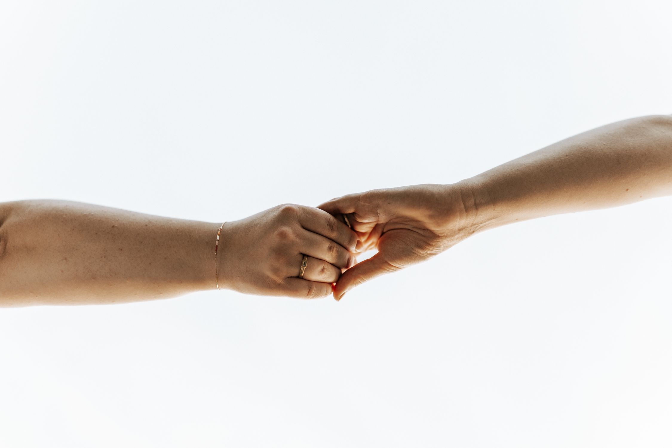 Hands Back Connect Two Hands Connecting Across a White Background · Free Stock Photo