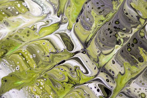 Free Vibrant abstract fluid art painting featuring green and white swirling patterns with black accents. Stock Photo