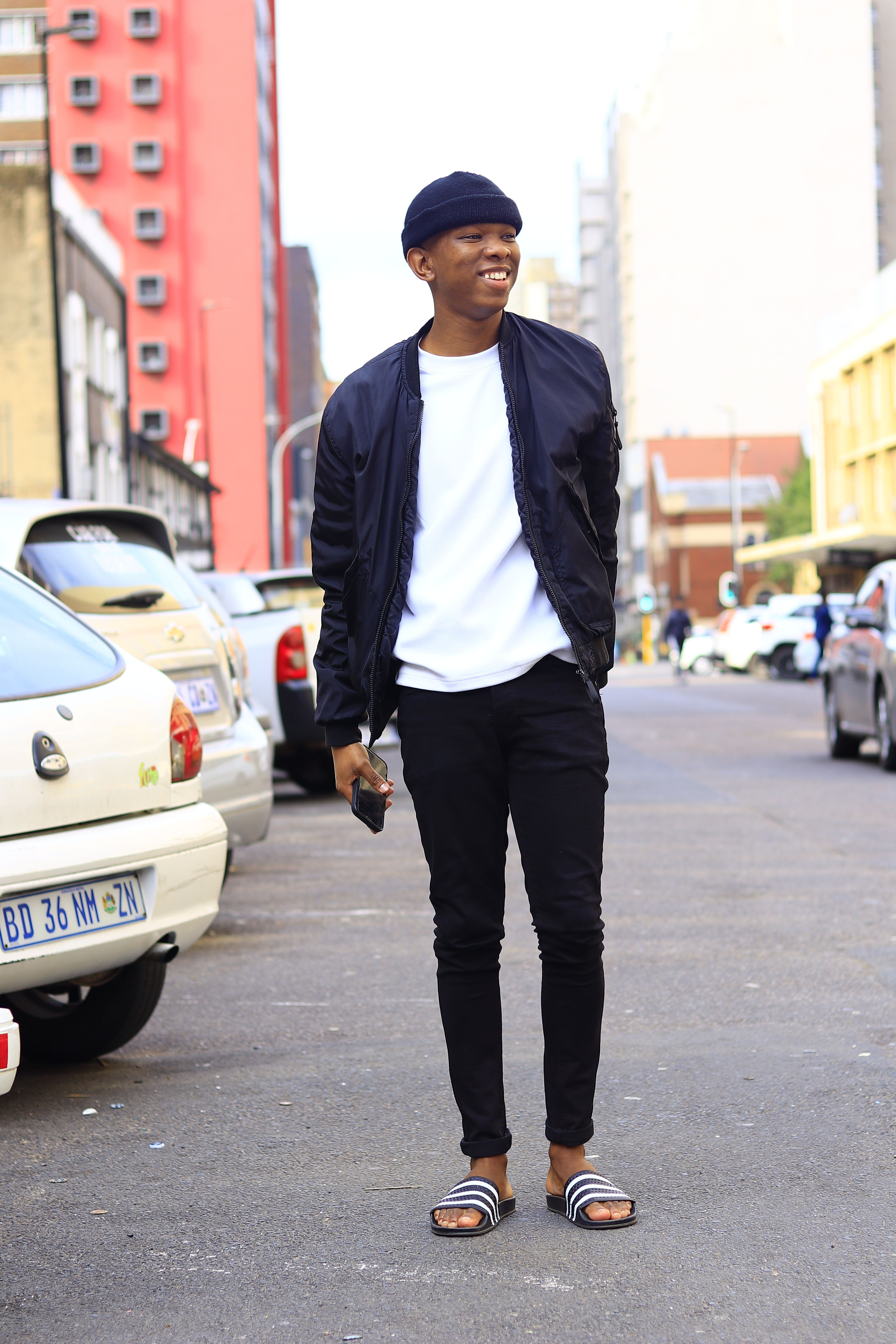 Stylish Young Man Walking in Urban Street · Free Stock Photo