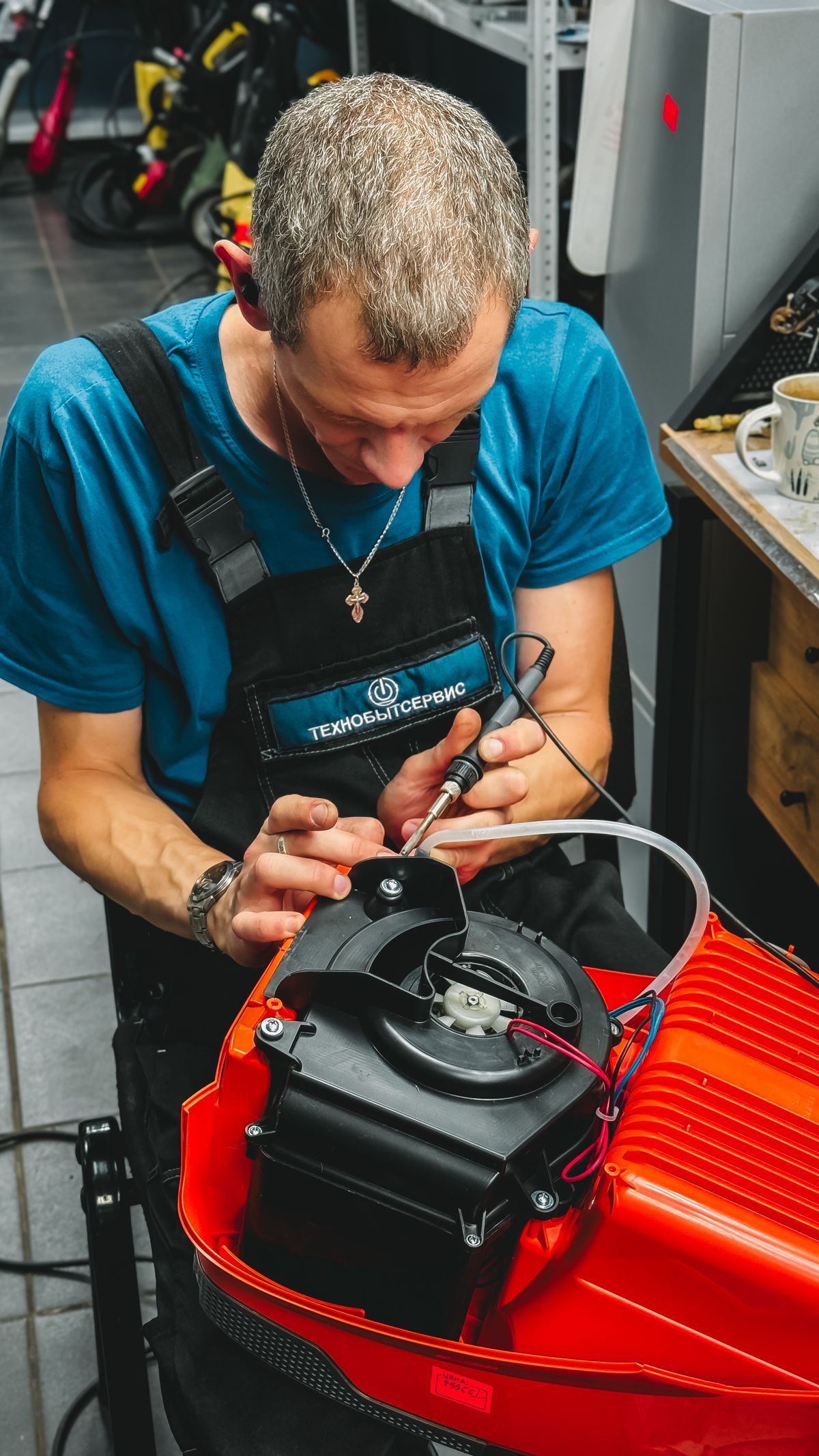 Technician repairing machinery