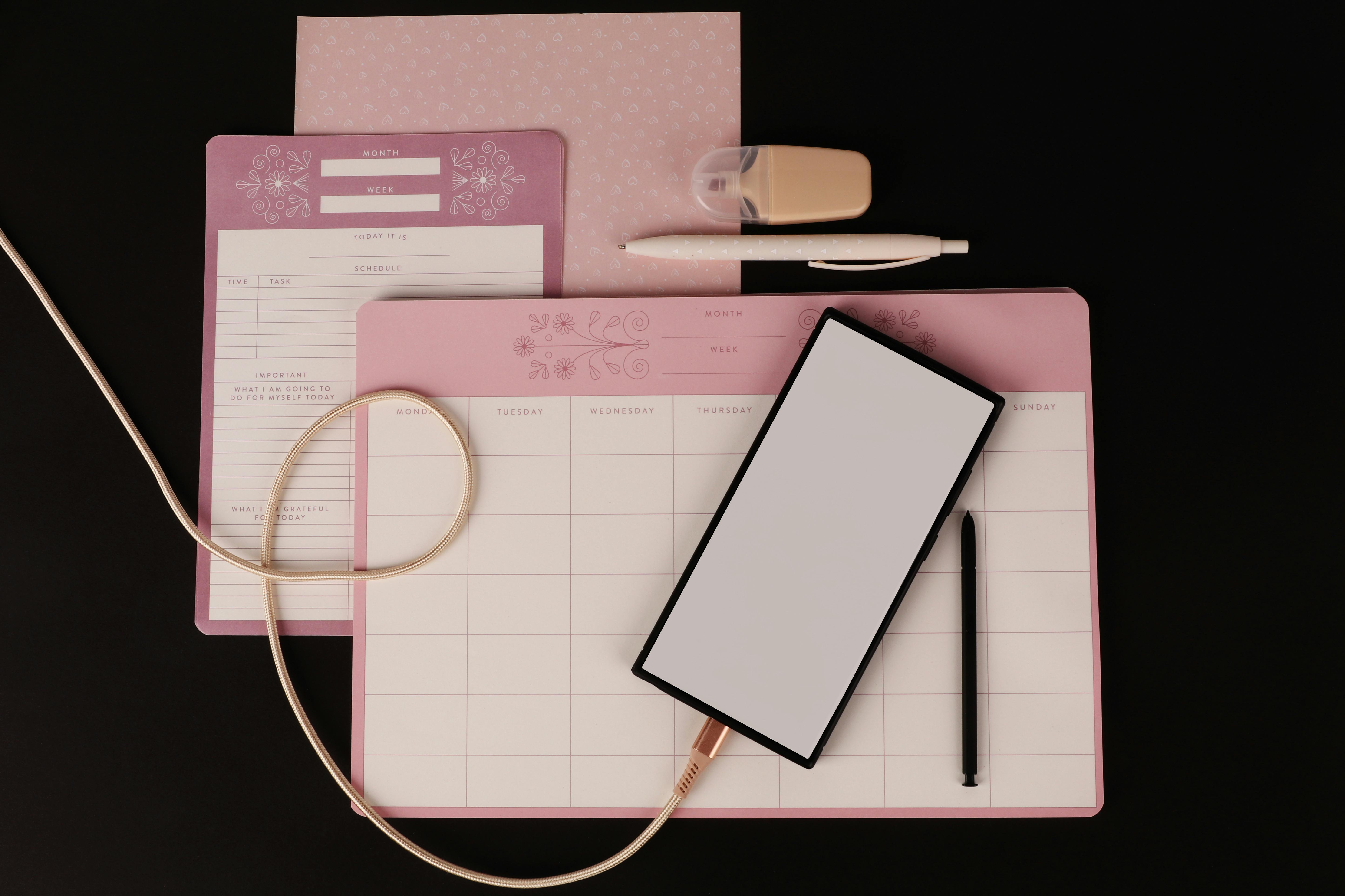 Organized desk with tablet and planner